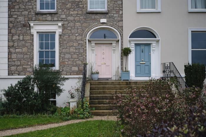 Pink Georgian doorway with stone steps leading up to it
