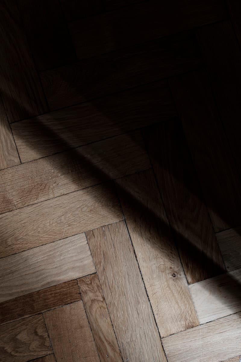 Soft, even sheen of light catching a satin-lacquered floor