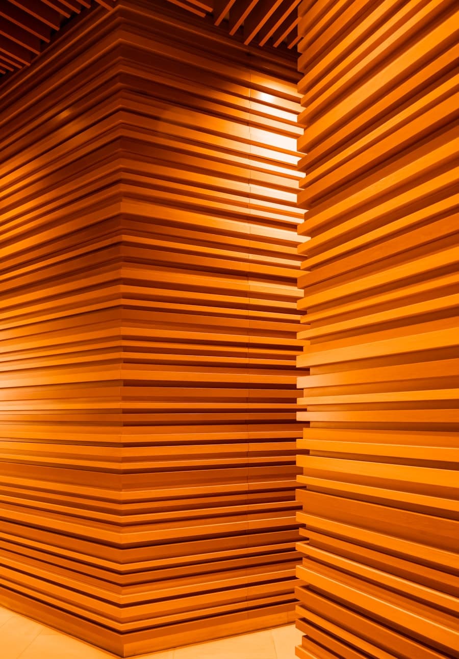 Warm timber slat panels running up a wall into the ceiling
