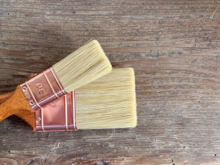 Paint brushes resting on a timber surface before interior decorating